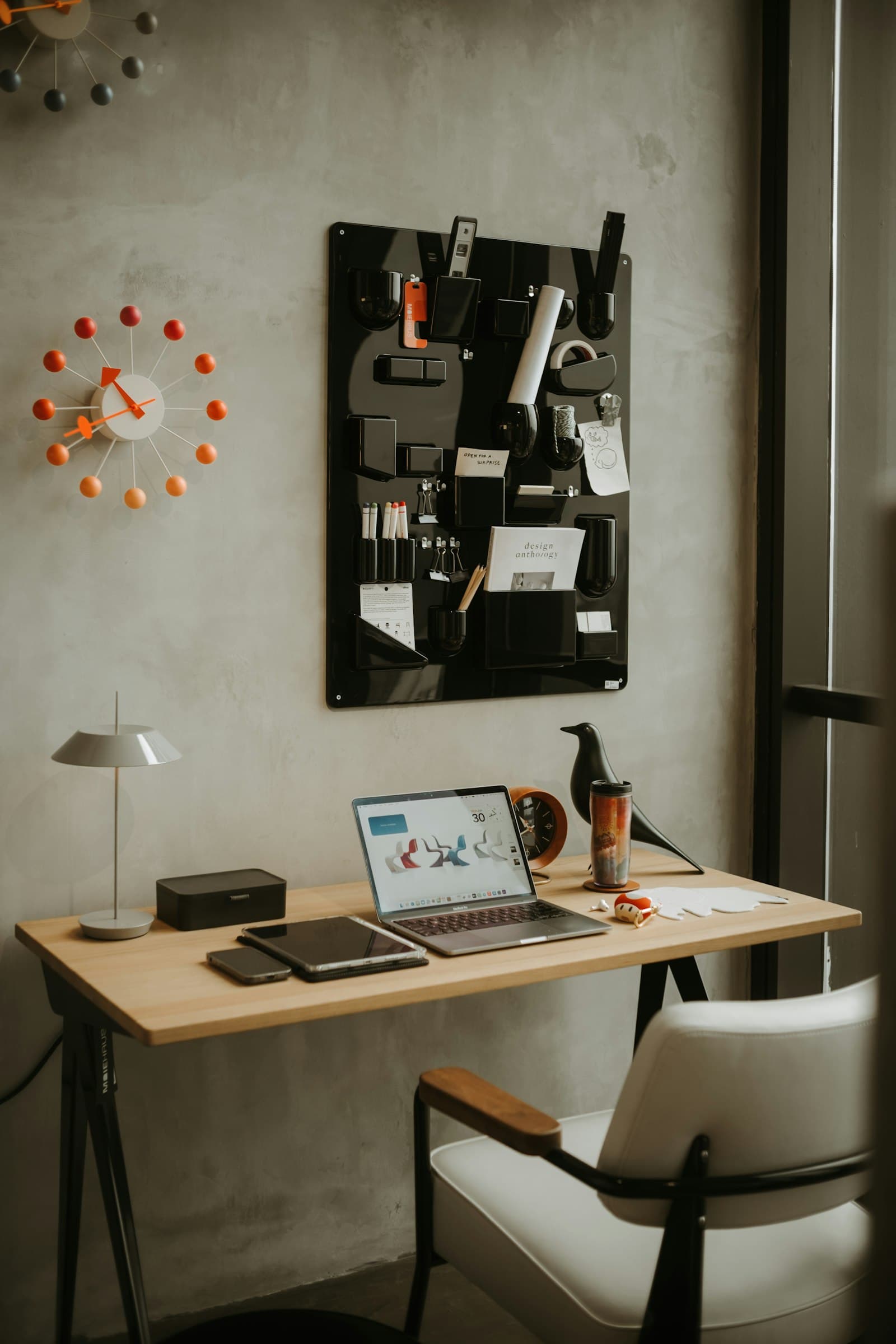 A clean modern workspace with a laptop and planning setup