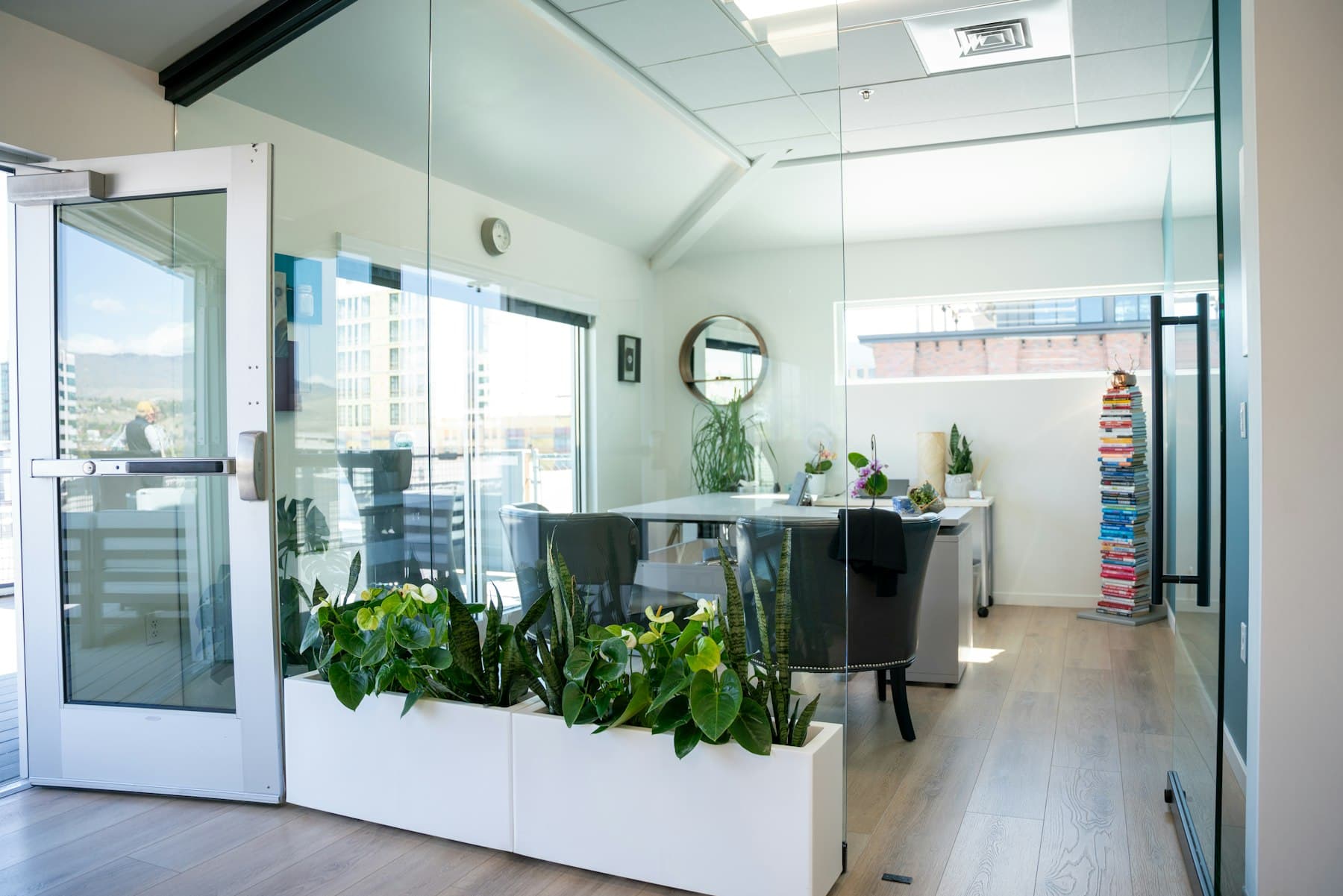 A bright modern office with glass walls and natural light